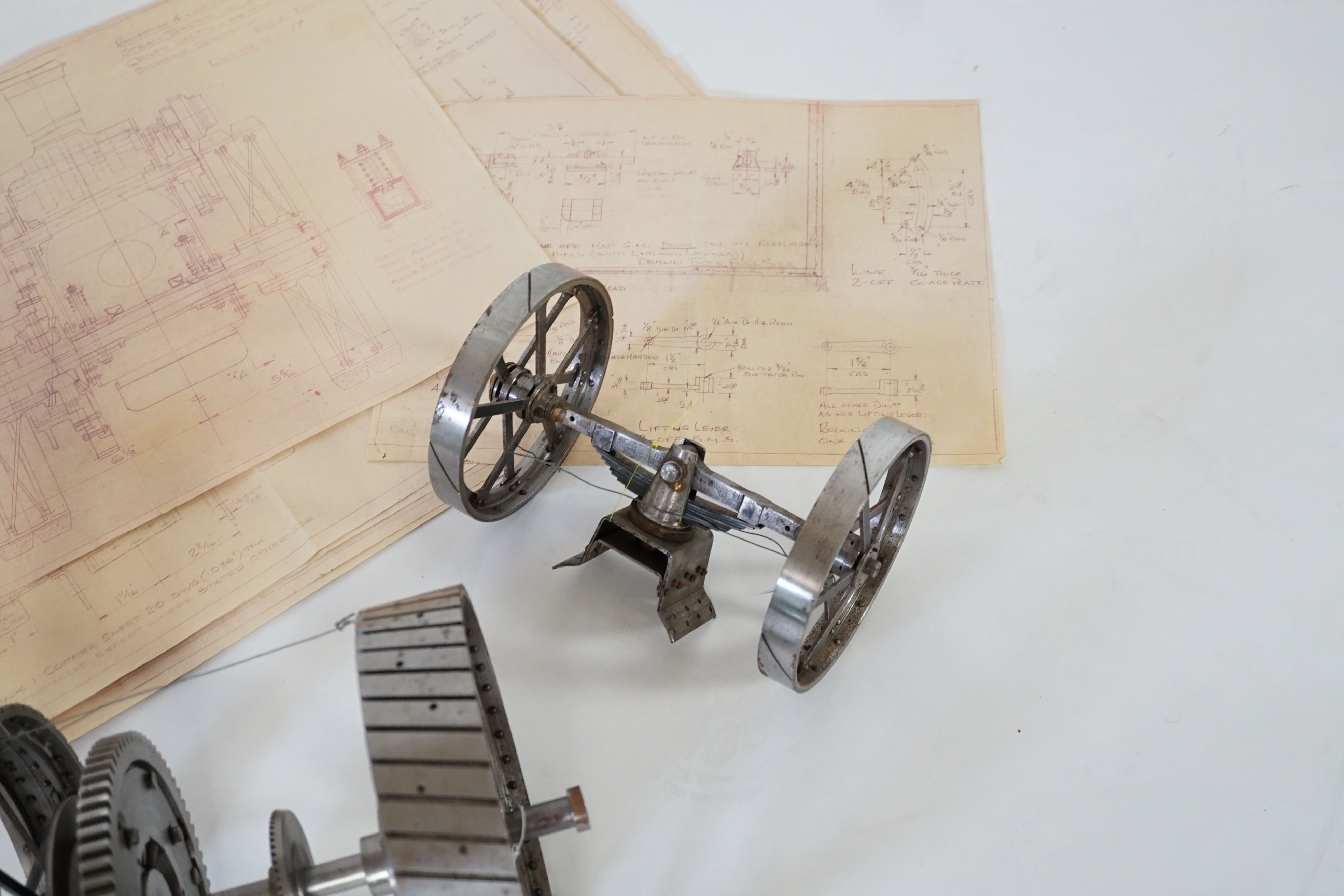 A partially constructed kit comprising of the major components of machined and cast parts to build a two inch scale live steam Ransomes 4 N.H.P. traction engine, including a set of drawings